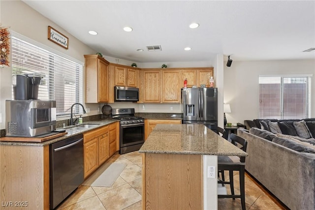 10329 Walworth Ave, Las Vegas, NV 89166 - kitchen featuring stainless steel appliances, a sink, light tile patterned floors, plenty of natural light, and recessed lighting
