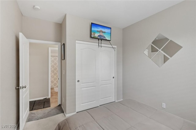 10329 Walworth Ave, Las Vegas, NV 89166 - unfurnished bedroom featuring baseboards, a closet, and tile patterned flooring