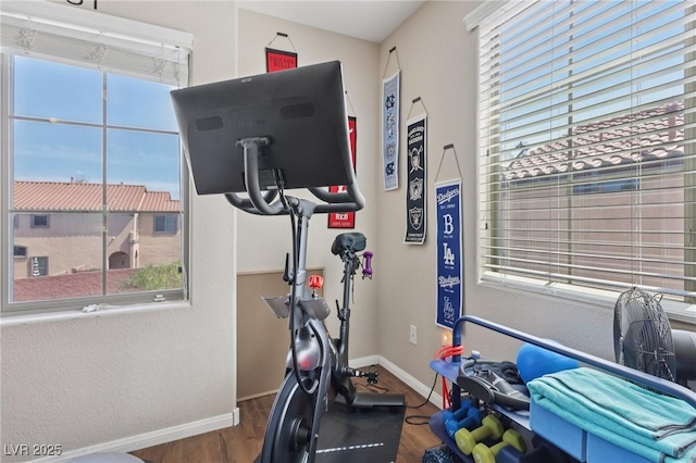 10329 Walworth Ave, Las Vegas, NV 89166 - exercise room with wood finished floors, healthy amount of natural light, and baseboards