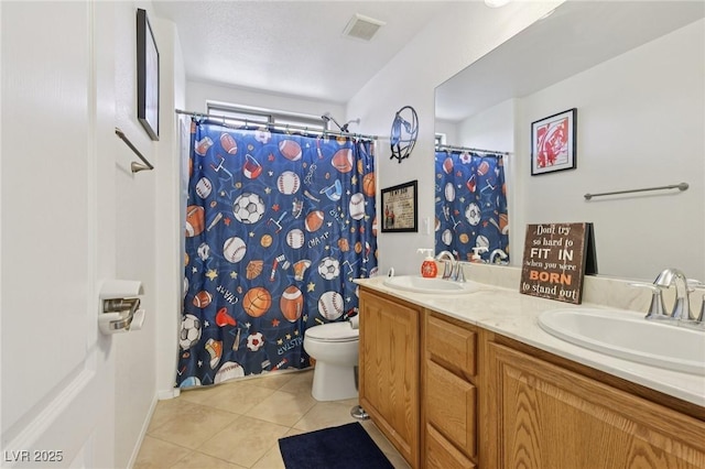 10329 Walworth Ave, Las Vegas, NV 89166 - full bath featuring tile patterned flooring, toilet, double vanity, and curtained shower