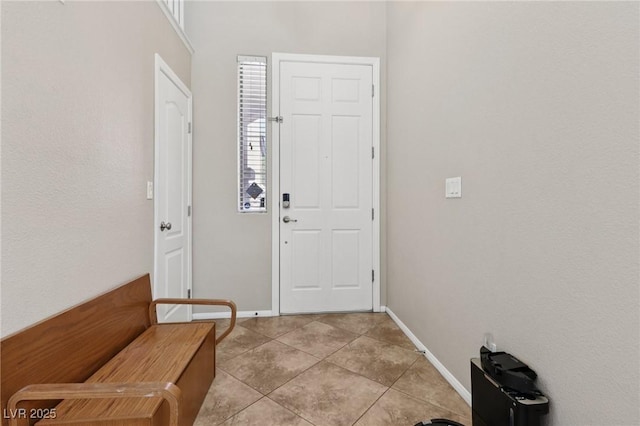 10329 Walworth Ave, Las Vegas, NV 89166 - entrance foyer featuring light tile patterned flooring and baseboards