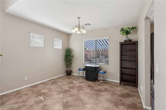 10329 Walworth Ave, Las Vegas, NV 89166 - dining area with a chandelier and baseboards
