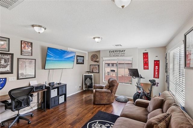 10329 Walworth Ave, Las Vegas, NV 89166 - living area featuring dark wood-style flooring, healthy amount of natural light, baseboards, a textured ceiling, and an office area