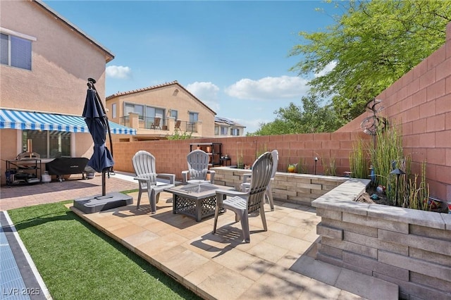 10329 Walworth Ave, Las Vegas, NV 89166 - fenced backyard featuring a fire pit and a patio area