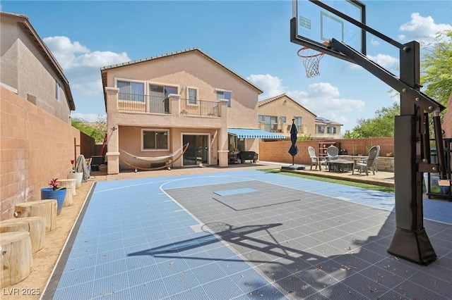 10329 Walworth Ave, Las Vegas, NV 89166 - view of basketball court with basketball hoop and a fenced backyard