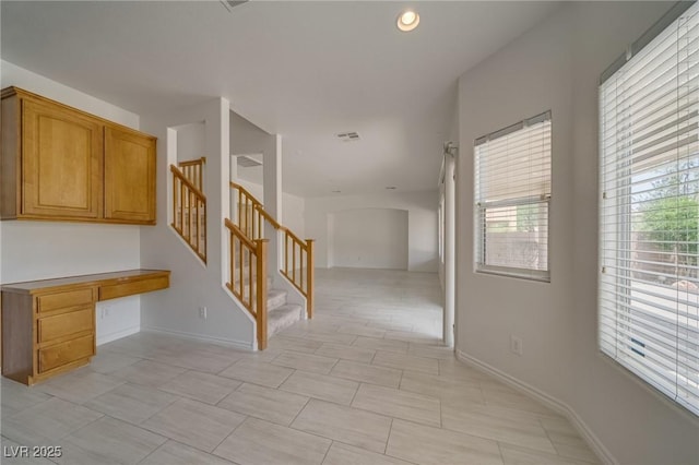 9792 Crescent Lodge Ct, Las Vegas, NV 89178 - hallway featuring stairs, a desk, baseboards, and recessed lighting