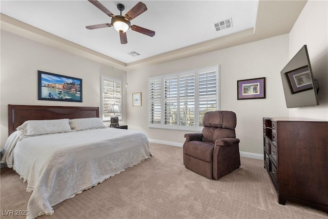 2749 Liberation Dr, Henderson, NV 89044 - bedroom with light colored carpet, a raised ceiling, baseboards, and a ceiling fan