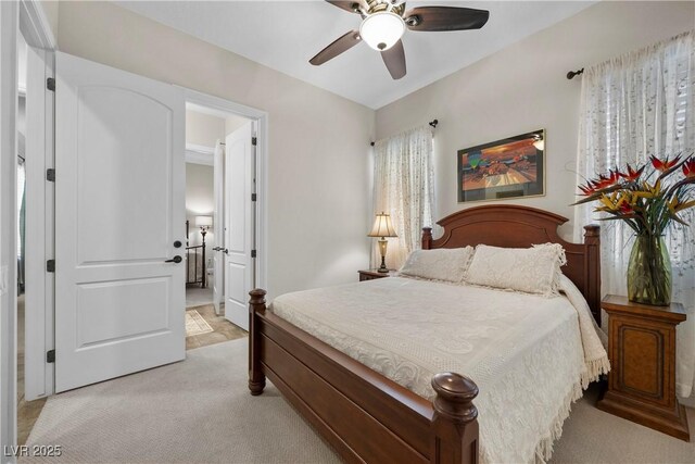 2749 Liberation Dr, Henderson, NV 89044 - bedroom featuring light colored carpet and ceiling fan