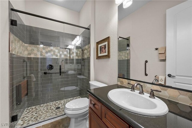 2749 Liberation Dr, Henderson, NV 89044 - bathroom with vanity, a stall shower, and toilet