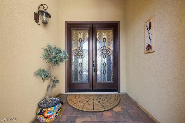2749 Liberation Dr, Henderson, NV 89044 - doorway to property with french doors and stucco siding