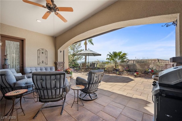 2749 Liberation Dr, Henderson, NV 89044 - fenced backyard featuring a patio, a ceiling fan, and grilling area