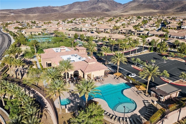 2749 Liberation Dr, Henderson, NV 89044 - aerial perspective of suburban area featuring a pool area and mountains