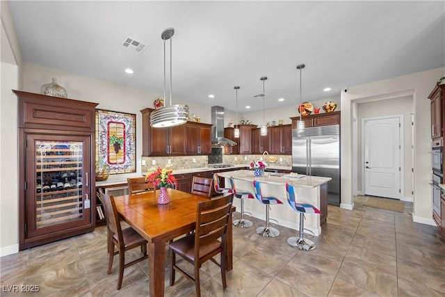 2749 Liberation Dr, Henderson, NV 89044 - dining area featuring wine cooler, recessed lighting, and baseboards