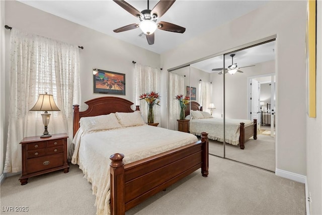 2749 Liberation Dr, Henderson, NV 89044 - bedroom with light colored carpet, a closet, multiple windows, and baseboards