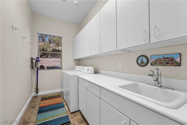 2749 Liberation Dr, Henderson, NV 89044 - laundry area featuring cabinet space, separate washer and dryer, and baseboards