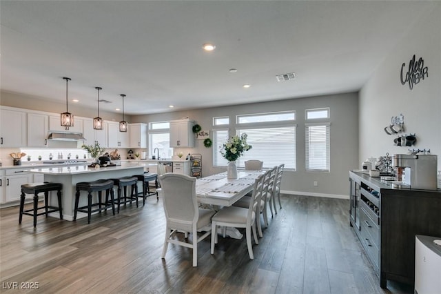 7077 Sunland Hills Ave, Las Vegas, NV 89113 - dining area with recessed lighting, wood finished floors, and baseboards
