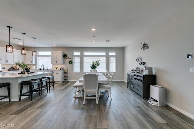 7077 Sunland Hills Ave, Las Vegas, NV 89113 - dining space with recessed lighting, dark wood-style floors, and baseboards