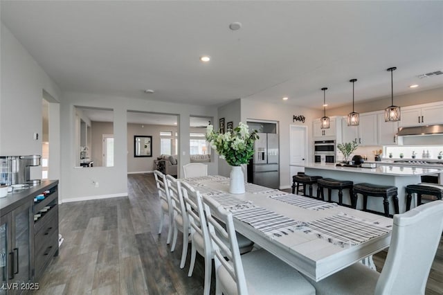 7077 Sunland Hills Ave, Las Vegas, NV 89113 - dining room with dark wood-style floors, baseboards, and recessed lighting
