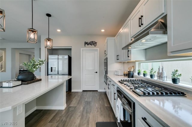 7077 Sunland Hills Ave, Las Vegas, NV 89113 - kitchen featuring under cabinet range hood, appliances with stainless steel finishes, dark wood-style flooring, recessed lighting, and decorative light fixtures