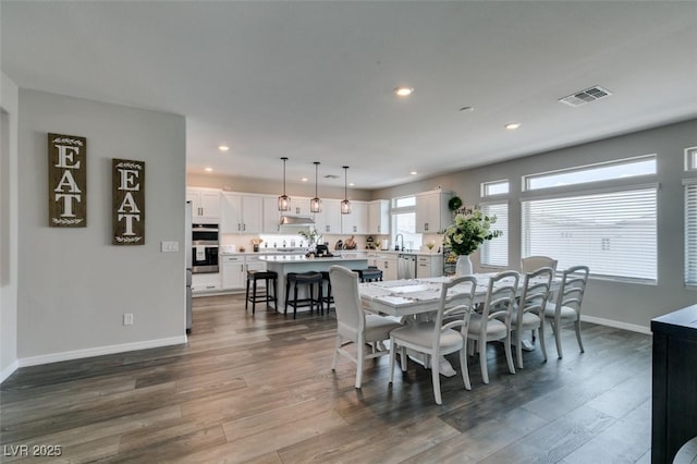 7077 Sunland Hills Ave, Las Vegas, NV 89113 - dining area with recessed lighting, baseboards, and dark wood-type flooring