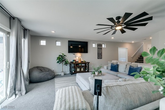 7077 Sunland Hills Ave, Las Vegas, NV 89113 - living room with light colored carpet, stairs, a ceiling fan, recessed lighting, and baseboards