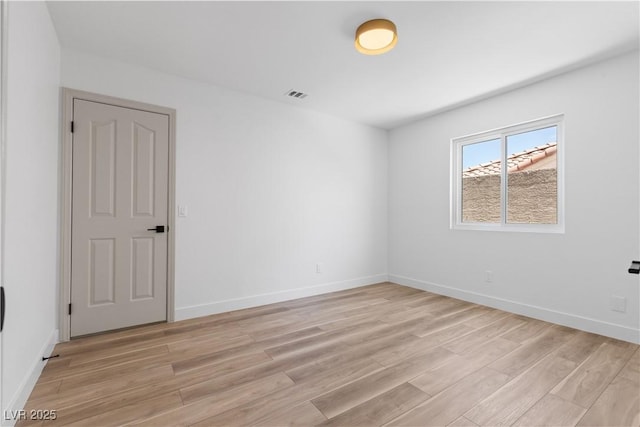 8032 Deep Stone Ave, Las Vegas, NV 89149 - unfurnished room featuring light wood-style floors and baseboards