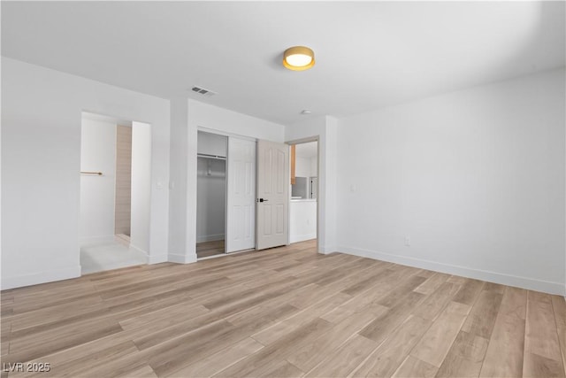 8032 Deep Stone Ave, Las Vegas, NV 89149 - unfurnished bedroom featuring light wood-type flooring, a closet, baseboards, and ensuite bathroom