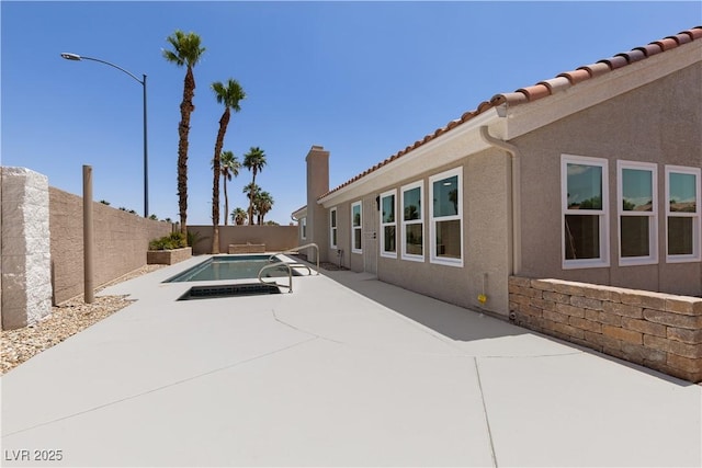 8032 Deep Stone Ave, Las Vegas, NV 89149 - fenced backyard featuring a patio and an in-ground hot tub