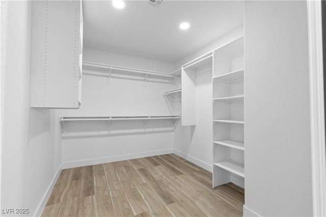 8032 Deep Stone Ave, Las Vegas, NV 89149 - spacious closet featuring wood finished floors