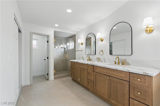 8032 Deep Stone Ave, Las Vegas, NV 89149 - bathroom with double vanity, a stall shower, recessed lighting, baseboards, and tile patterned flooring