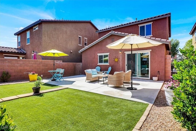 9236 Keystone Ridge Ave, Las Vegas, NV 89148 - back of house with stucco siding, a patio area, an outdoor living space, and a tiled roof