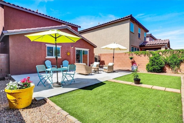 9236 Keystone Ridge Ave, Las Vegas, NV 89148 - rear view of property featuring stucco siding and a patio area