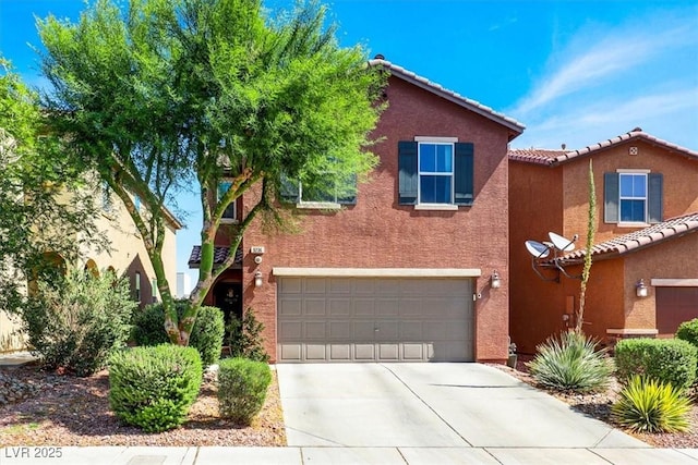 9236 Keystone Ridge Ave, Las Vegas, NV 89148 - view of front facade featuring stucco siding, concrete driveway, a garage, and a tile roof