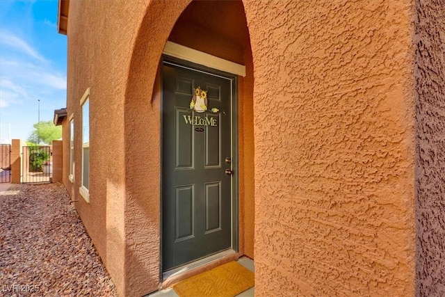 9236 Keystone Ridge Ave, Las Vegas, NV 89148 - entrance to property with stucco siding and a gate