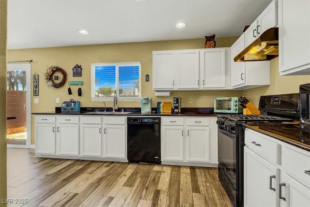 9236 Keystone Ridge Ave, Las Vegas, NV 89148 - kitchen featuring black appliances, extractor fan, a sink, light wood-type flooring, and recessed lighting