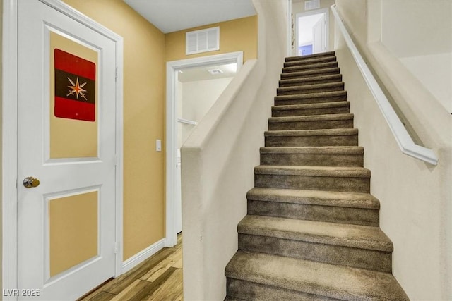 9236 Keystone Ridge Ave, Las Vegas, NV 89148 - stairs featuring wood finished floors and baseboards