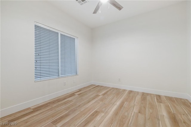 827 Happy Sparrow Ave, Henderson, NV 89052 - spare room with a ceiling fan, light wood-style floors, and baseboards