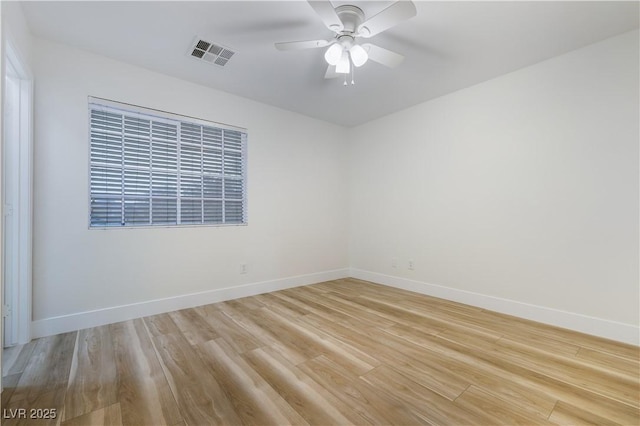 827 Happy Sparrow Ave, Henderson, NV 89052 - spare room featuring light wood-style flooring, baseboards, and ceiling fan