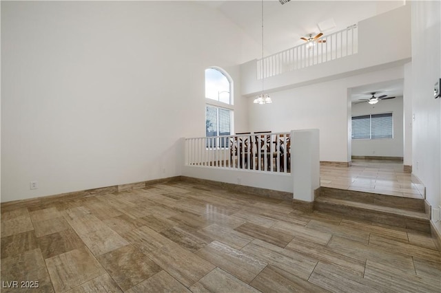 827 Happy Sparrow Ave, Henderson, NV 89052 - spare room with ceiling fan, a high ceiling, and a chandelier
