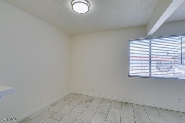 212 Orland St Unit 28, Las Vegas, NV 89107 - unfurnished room with a textured ceiling and baseboards