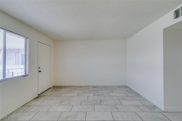 212 Orland St Unit 28, Las Vegas, NV 89107 - unfurnished room featuring a textured ceiling and baseboards