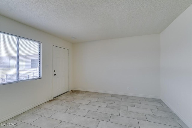 212 Orland St Unit 28, Las Vegas, NV 89107 - empty room with a textured ceiling and baseboards