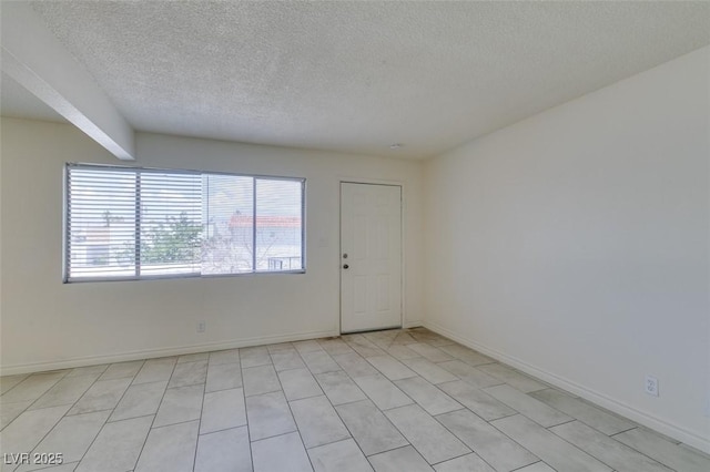 212 Orland St Unit 28, Las Vegas, NV 89107 - unfurnished room featuring a textured ceiling and baseboards