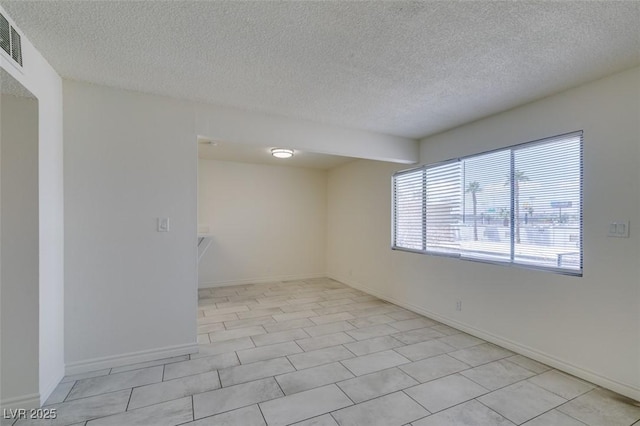 212 Orland St Unit 28, Las Vegas, NV 89107 - unfurnished room with a textured ceiling and baseboards