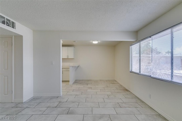 212 Orland St Unit 28, Las Vegas, NV 89107 - empty room with a textured ceiling and baseboards