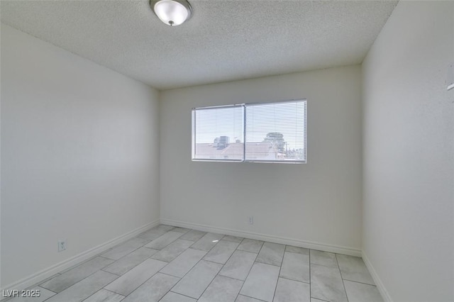212 Orland St Unit 28, Las Vegas, NV 89107 - spare room featuring a textured ceiling and baseboards