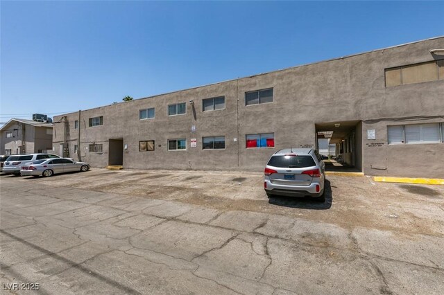 212 Orland St Unit 28, Las Vegas, NV 89107 - view of building exterior with uncovered parking