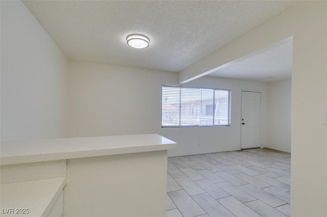 212 Orland St Unit 28, Las Vegas, NV 89107 - empty room featuring a textured ceiling and light tile patterned floors