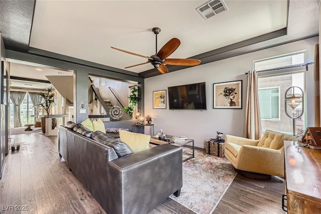 8121 Russell Creek Ct, Las Vegas, NV 89139 - living room with wood finished floors, a ceiling fan, plenty of natural light, and baseboards