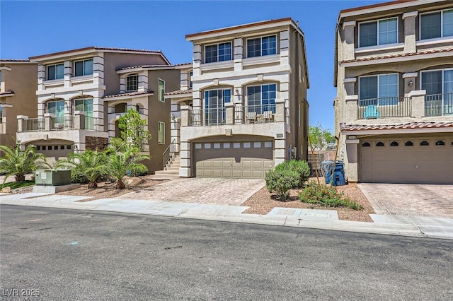 8121 Russell Creek Ct, Las Vegas, NV 89139 - view of front of property featuring an attached garage, decorative driveway, and stucco siding